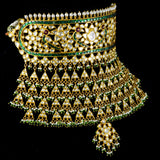 Elevate your elegance with our exquisite Green Meena Ard necklace, adorned with shimmering diamond polki and lustrous pearls. A timeless treasure for every occasion.(KMNE3291)