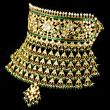 Elevate your elegance with our exquisite Green Meena Ard necklace, adorned with shimmering diamond polki and lustrous pearls. A timeless treasure for every occasion.(KMNE3291)