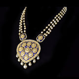 Elegant long necklace featuring rich blue enamel detailing, adorned with gold and uncut diamond polki floral motifs, gracefully strung with lustrous pearls in gold wire, creating a timeless blend of tradition and sophistication. (KMNE3371)