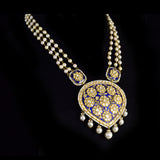 Elegant long necklace featuring rich blue enamel detailing, adorned with gold and uncut diamond polki floral motifs, gracefully strung with lustrous pearls in gold wire, creating a timeless blend of tradition and sophistication. (KMNE3371)