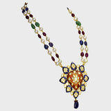 Red and blue Meena big pendant, adorned with dazzling diamond polki, strung alongside the rich hues of emerald, ruby, sapphire, and the lustrous elegance of South Sea pearls.(KMNE3406)