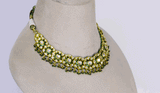 Elevate your elegance with this exquisite green Meena necklace and earring set, adorned with uncut diamonds. A timeless fusion of traditional artistry and luxury, perfect for weddings and grand celebrations.(KMNE3525)