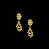 Radiate regal charm with this stunning red enameled necklace and earring set, intricately crafted with uncut diamonds. A perfect blend of heritage and glamour for festive occasions and bridal elegance. (KMNE3553)