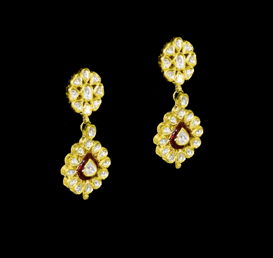 Radiate regal charm with this stunning red enameled necklace and earring set, intricately crafted with uncut diamonds. A perfect blend of heritage and glamour for festive occasions and bridal elegance. (KMNE3553)