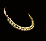 Radiate regal charm with this stunning red enameled necklace and earring set, intricately crafted with uncut diamonds. A perfect blend of heritage and glamour for festive occasions and bridal elegance. (KMNE3553)