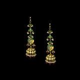 This white choker necklace and jhoomki pair is beautifully crafted with uncut diamonds, and strung with rubies and pearls. A perfect blend of elegance and tradition for weddings and festive occasions.(KMNE3585)