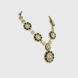 Make a bold statement with this stunning fusion-style necklace set, featuring a dazzling blend of diamond polki, round diamonds, and rich emerald beads. A perfect mix of tradition and modern glamour.(KMNE3592)