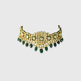 Embrace timeless elegance with this green Meena choker necklace and tops set, featuring sparkling uncut diamond polki, strung with vibrant emerald maniya and delicate pearls. Perfect for adding royal charm to any festive or bridal look.(KMNE3604)
