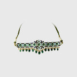 Embrace timeless elegance with this green Meena choker necklace and tops set, featuring sparkling uncut diamond polki, strung with vibrant emerald maniya and delicate pearls. Perfect for adding royal charm to any festive or bridal look.(KMNE3604)