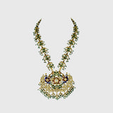 Celebrate tradition with this vibrant multi-color enameled long necklace and earring pair, adorned with uncut diamonds and pearls. Featuring intricate fish design links and a majestic peacock pendant. (KMNE3605)