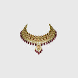 Beautiful red enameled flower design necklace and earrings set with sparkling uncut diamond polki, strung with ruby maniya and pearls. Perfect to add a touch of tradition and elegance to any special occasion.(KMNE3608)