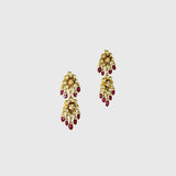 Beautiful red enameled flower design necklace and earrings set with sparkling uncut diamond polki, strung with ruby maniya and pearls. Perfect to add a touch of tradition and elegance to any special occasion.(KMNE3608)