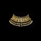 Elevate your style with this stunning semi-choker necklace and earring pair, featuring dazzling uncut diamond polki and a striking larger center stone, beautifully strung with pearls. Perfect for adding royal charm to any special occasion.(KMNE3611)