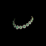 Discover refined elegance with this fusion-style necklace set, featuring a carved emerald centerpiece surrounded by uncut diamond Polki. A perfect harmony of tradition and modernity, crafted to make a statement.(KMNE3614)