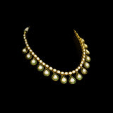 Elegance redefined with this stunning necklace, featuring uncut diamond Polki and graceful pear-shaped drops. A timeless design that captures the essence of luxury, perfect for weddings, festivities.(KMNE3617)