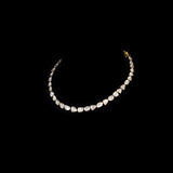 Understated elegance shines through this single-line necklace and earring pair, featuring uncut diamond Polki. A graceful blend of tradition and simplicity—perfect for intimate celebrations and timeless everyday sophistication.(KMNE3620)