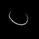 Understated elegance shines through this single-line necklace and earring pair, featuring uncut diamond Polki. A graceful blend of tradition and simplicity—perfect for intimate celebrations and timeless everyday sophistication.(KMNE3620)