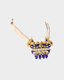 A traditional necklace crafted with diamond polki, highlighted by rich blue meena work and finished with elegant pearl stringing. Reflecting classic Indian artistry, this timeless design is perfect for weddings and festive occasions. (KMNE3639)