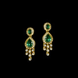 This exquisite set features luminous polki diamonds highlighted by rich green stones, embodying heritage craftsmanship and royal charm. (KMNE3675)