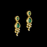 This exquisite set features luminous polki diamonds highlighted by rich green stones, embodying heritage craftsmanship and royal charm. (KMNE3675)