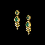 This exquisite set features luminous polki diamonds highlighted by rich green stones, embodying heritage craftsmanship and royal charm. (KMNE3675)