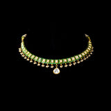 A refined single-line gold necklace set featuring polki diamonds with green enamel detailing, accented by delicate pearl hangings, paired with matching earrings—perfectly blending traditional elegance with understated, modern sophistication. (KMNE3722)