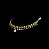 A refined single-line gold necklace set featuring polki diamonds with green enamel detailing, accented by delicate pearl hangings, paired with matching earrings—perfectly blending traditional elegance with understated, modern sophistication. (KMNE3722)