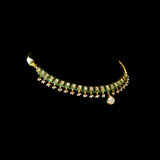 A refined single-line gold necklace set featuring polki diamonds with green enamel detailing, accented by delicate pearl hangings, paired with matching earrings—perfectly blending traditional elegance with understated, modern sophistication. (KMNE3722)