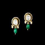 A majestic choker showcasing large polki diamonds set in striking green-enamelled gold, layered with intricate detailing, finished with cascading emerald drops and pearl fringes—opulent, bold, and exquisitely regal. (KMNE3724)