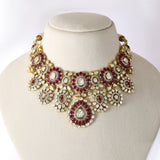 An exquisite fusion-style necklace set featuring sparkling Polki diamonds, brilliant round diamonds, and rich ruby accents, crafted in a bold heavy design to create a luxurious statement with timeless elegance and royal charm. (KMNE3727)