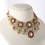 An exquisite fusion-style necklace set featuring sparkling Polki diamonds, brilliant round diamonds, and rich ruby accents, crafted in a bold heavy design to create a luxurious statement with timeless elegance and royal charm. (KMNE3727)