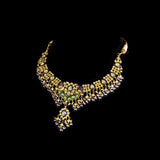 Grand statement necklace and earring pair featuring intricate peacock meenakari in vibrant hues, adorned with uncut diamond polki, highlighted by cascading multicolor beads with pearls, reflecting regal artistry and timeless bridal elegance. (KMNE3743)