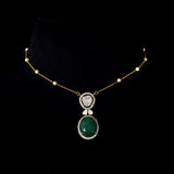 Diamond Polki & Emerald Pendant A graceful pendant featuring diamond polki, brilliant round diamonds, a striking emerald cabochon, and a delicate gold chain accented with elegant pearls for timeless sophistication.(KMNE3744)