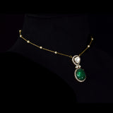 Diamond Polki & Emerald Pendant A graceful pendant featuring diamond polki, brilliant round diamonds, a striking emerald cabochon, and a delicate gold chain accented with elegant pearls for timeless sophistication.(KMNE3744)