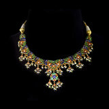 Exquisite gold necklace and earring set featuring uncut diamond polki, peacock meenakari in blue and green, and delicate pearls, blending royal heritage craftsmanship with timeless elegance for statement occasions. (KMNE3746)