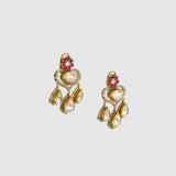 A graceful fusion necklace with diamond polki, round diamonds, vibrant rubies, and elegant pearl stringing, paired with matching earrings for timeless sophistication and charm.(KMNE3759)