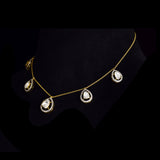 Delicate pear-shaped diamond Polki gracefully framed by shimmering round diamonds, creating a timeless station necklace with effortless elegance and brilliance.(KMNE3775)