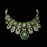 Inspired by royal artistry, this fusion necklace set combines dazzling diamond Polki, brilliant round diamonds, vibrant emeralds, and intricate floral craftsmanship for an effortlessly luxurious statement.(KMNE3782)
