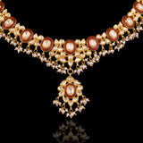Grace every celebration with this handcrafted red meenakari necklace and earrings, featuring natural Polki diamonds and pearl accents.(KMNE3790)