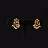 Grace every celebration with this handcrafted red meenakari necklace and earrings, featuring natural Polki diamonds and pearl accents.(KMNE3790)