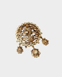 A diamond polki and round brilliant diamond pendant in an open setting that enhances brilliance. Finished with antique gold polish and paired with a delicate gold chain, it reflects timeless craftsmanship and understated elegance. (KMPE1320)