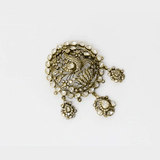 A diamond polki and round brilliant diamond pendant in an open setting that enhances brilliance. Finished with antique gold polish and paired with a delicate gold chain, it reflects timeless craftsmanship and understated elegance. (KMPE1320)