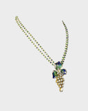 A pendant and earring set featuring diamond polki and round brilliant diamonds, accented with green and blue French enamel. Designed in a refined fusion style, it blends traditional artistry with a contemporary touch, ideal for festive occasions(KMPE1348)