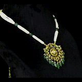 Graceful peacock pendant set adorned with diamond polki, delicately strung with pearls and emerald maniya, celebrating timeless heritage and refined elegance.(KMPE1364)
