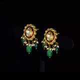 Graceful peacock pendant set adorned with diamond polki, delicately strung with pearls and emerald maniya, celebrating timeless heritage and refined elegance.(KMPE1364)