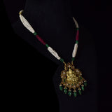 Divine Temple Pendant Exquisite temple-style pendant featuring Goddess Lakshmi, sparkling diamond polki, vibrant coloured gemstones, and emerald drops, celebrating timeless heritage and divine elegance.(KMPE1373)