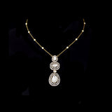 Featuring hand-set polki diamonds with shimmering diamond halos and a gold chain adorned with pearls, this pendant is a masterpiece of heritage luxury. (KMPE1384)
