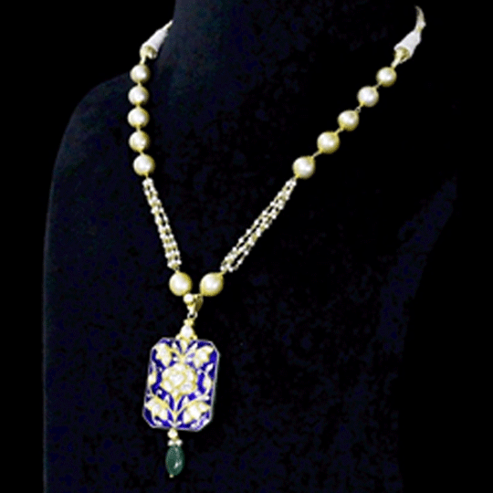 Blue Meenakari Pendant Set Elegant blue meenakari pendant set adorned with diamond polki, gracefully strung with pearls and emerald accents, blending timeless artistry with refined elegance.(KMPE1397)