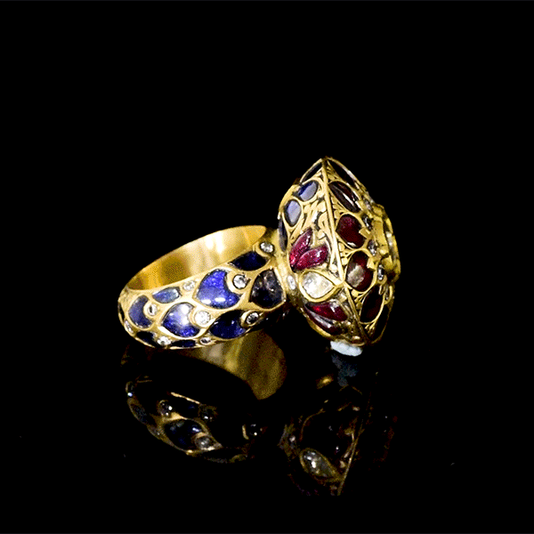 Celebrate timeless beauty with this traditional Jadau ring, adorned with vibrant color stones and sparkling diamond Polki. A masterpiece of heritage craftsmanship, perfect for adding regal elegance to any occasion.(KMR0168)