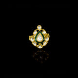 Grace your fingers with this green enameled ring, featuring uncut diamond Polki. Adjustable in size, it blends traditional charm with modern comfort for effortless elegance.(KMR0173)